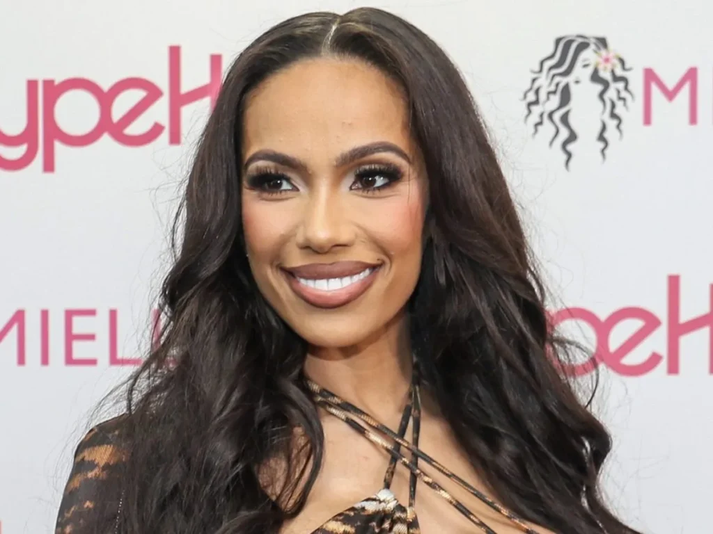Erica Mena's fitness routine showing her body measurements, erica mena net worth 2025, Erica Mena's luxury car and designer accessories display, Erica Mena posing at Love & Hip Hop red carpet event, wearing designer outfit, Erica Mena working on set of Love & Hip Hop reality TV show